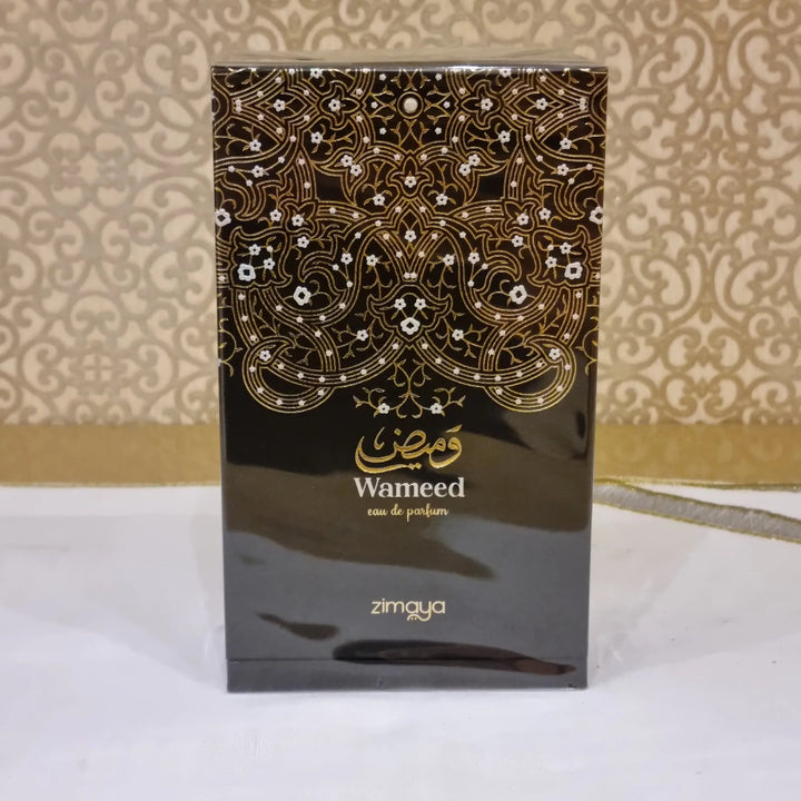 Perfume bottle with intricate design and 'Wameed' branding on a patterned background